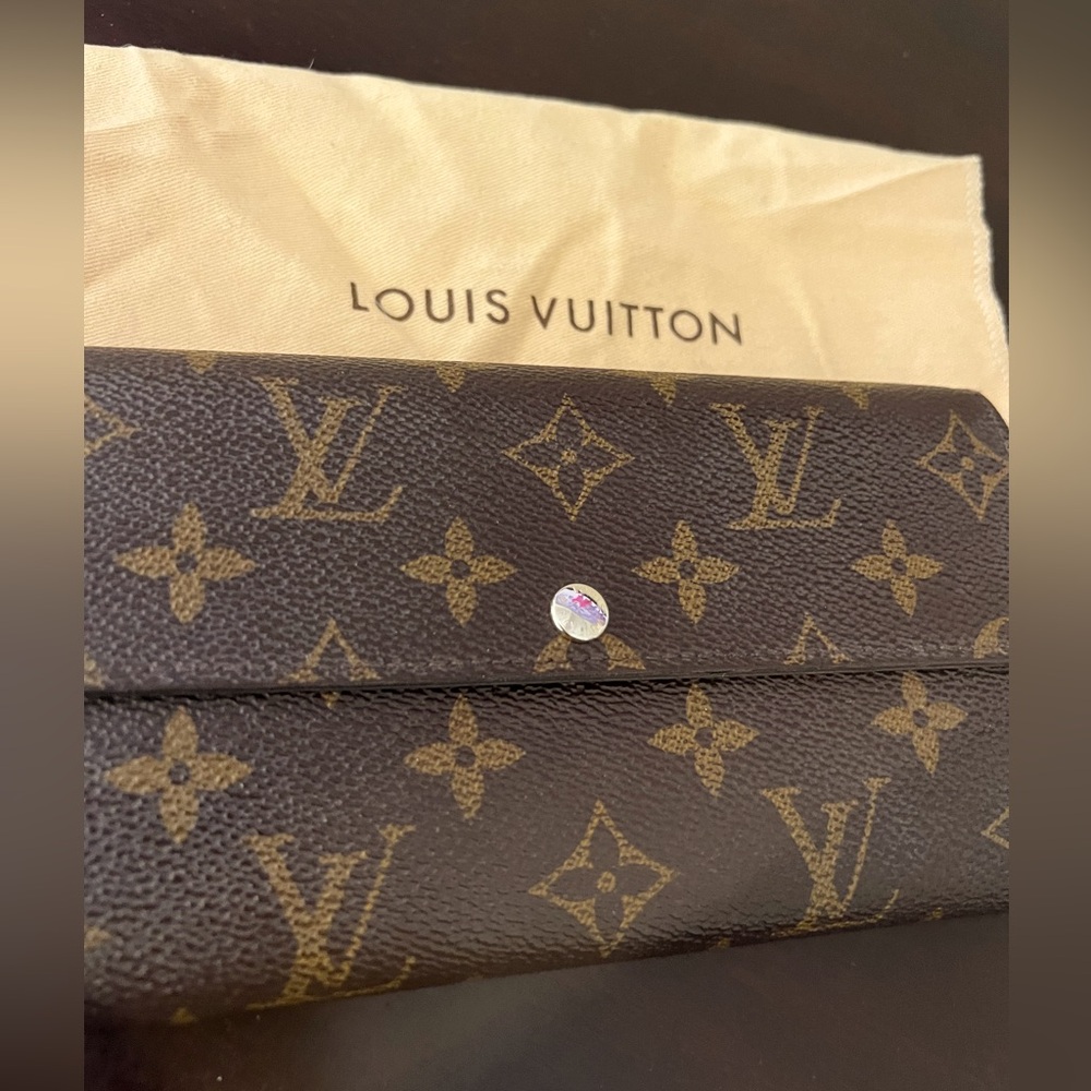 LV purchase about 8 years ago well loved and in good condition with dust bags